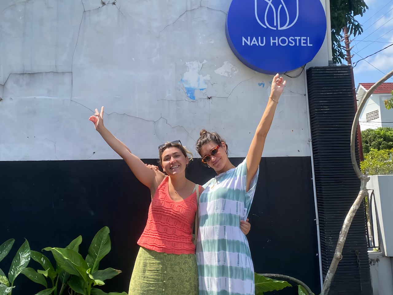 Guests celebrating outside Nau Hostel